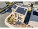Aerial view of home with solar panels, pristine landscaping, and a brick driveway at 5946 Ancient Peaks Ave, Las Vegas, NV 89141