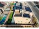 Aerial view of home featuring solar panels, putting green, rooftop deck and swimming pool at 5946 Ancient Peaks Ave, Las Vegas, NV 89141
