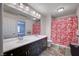 Bathroom featuring double sinks, spacious countertop, shower with pink curtain, and stylish accents at 5946 Ancient Peaks Ave, Las Vegas, NV 89141