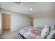 Neutral bedroom featuring carpet, a patterned comforter on the bed, and a walk in closet at 5946 Ancient Peaks Ave, Las Vegas, NV 89141