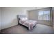 Bright bedroom featuring natural light, carpeting, and neutral paint at 5946 Ancient Peaks Ave, Las Vegas, NV 89141