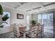 Bright dining room with stylish table, chairs, buffet, coffered ceilings and natural light at 5946 Ancient Peaks Ave, Las Vegas, NV 89141