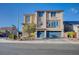 A modern two-story home with a three car garage, desert landscaping, and neutral color palette at 5946 Ancient Peaks Ave, Las Vegas, NV 89141
