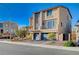 A modern two-story home with desert landscaping, three car garage, and neutral color palette at 5946 Ancient Peaks Ave, Las Vegas, NV 89141