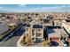 Aerial view of a two-story home boasting solar panels and desert landscaping in a large neighborhood at 5946 Ancient Peaks Ave, Las Vegas, NV 89141