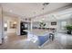Spacious open-concept kitchen with island and adjacent dining area with plenty of natural light at 5946 Ancient Peaks Ave, Las Vegas, NV 89141