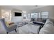 Bright living room features neutral tones, plush seating, and a modern entertainment center at 5946 Ancient Peaks Ave, Las Vegas, NV 89141