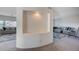 Open-concept living space with neutral paint, plush gray carpeting, and built-in media niche at 5946 Ancient Peaks Ave, Las Vegas, NV 89141