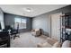 Comfortable office space with natural light, neutral colors, and functional layout with desk and seating at 5946 Ancient Peaks Ave, Las Vegas, NV 89141
