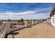 A spacious balcony features white railings and scenic views of the city and mountains beyond at 6915 Cedar Basin Ave, Las Vegas, NV 89142
