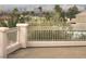 Balcony view showcasing palm trees, city buildings, and distant mountain scenery at 6915 Cedar Basin Ave, Las Vegas, NV 89142