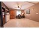Spacious bedroom with a ceiling fan, neutral paint, and tile flooring at 6915 Cedar Basin Ave, Las Vegas, NV 89142
