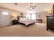 Bright, spacious bedroom with ceiling fan, carpet, and ample natural light at 6915 Cedar Basin Ave, Las Vegas, NV 89142