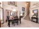 Open-concept dining room with high ceilings and a view of the staircase and second floor at 6915 Cedar Basin Ave, Las Vegas, NV 89142