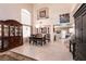Elegant dining room features high ceilings, large windows, and easy access to the living spaces at 6915 Cedar Basin Ave, Las Vegas, NV 89142
