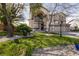 Stunning two-story home boasts a well-manicured lawn, mature trees, and a three-car garage at 6915 Cedar Basin Ave, Las Vegas, NV 89142