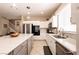 Bright kitchen with white cabinets, stainless steel appliances, and a spacious island at 6915 Cedar Basin Ave, Las Vegas, NV 89142
