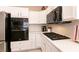 Updated kitchen featuring stainless steel appliances and stylish white countertops at 6915 Cedar Basin Ave, Las Vegas, NV 89142