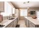 Bright, modern kitchen with white cabinetry, stainless steel appliances, and ample counter space at 6915 Cedar Basin Ave, Las Vegas, NV 89142