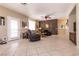 Open concept living area with tile flooring and large windows at 6915 Cedar Basin Ave, Las Vegas, NV 89142