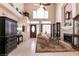 Inviting living room with fireplace, high ceilings, and ample natural light at 6915 Cedar Basin Ave, Las Vegas, NV 89142