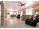 Open-concept living area with tile floors connecting to kitchen, perfect for entertaining and Gathering gatherings at 6915 Cedar Basin Ave, Las Vegas, NV 89142