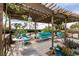 Covered patio featuring comfortable outdoor seating, plants, and decorative birdcages at 6915 Cedar Basin Ave, Las Vegas, NV 89142