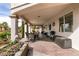 Covered patio perfect for outdoor dining and relaxing with seating and well-maintained landscaping at 6915 Cedar Basin Ave, Las Vegas, NV 89142