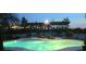 Backyard swimming pool with a covered pergola and outdoor seating area, illuminated at twilight at 6915 Cedar Basin Ave, Las Vegas, NV 89142