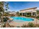 Backyard pool and covered patio create an outdoor oasis with mature landscaping at 6915 Cedar Basin Ave, Las Vegas, NV 89142