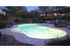Inviting backyard pool with lush landscaping and covered patio, perfect for outdoor entertaining and relaxation at 6915 Cedar Basin Ave, Las Vegas, NV 89142