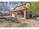 Large backyard with patio and partially-shaded groundcover; the home features a terra cotta tile roof at 7425 Enchanted Hills Ct, Las Vegas, NV 89129