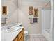 Bathroom featuring sink with framed mirror, shower with curtain, and standard toilet at 7425 Enchanted Hills Ct, Las Vegas, NV 89129