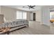 Bright bedroom with a ceiling fan, a full bed, and an ensuite bathroom at 7425 Enchanted Hills Ct, Las Vegas, NV 89129