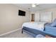 Bedroom featuring neutral walls, light floors, standard closet, and ceiling fan at 7425 Enchanted Hills Ct, Las Vegas, NV 89129
