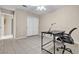 Clean bedroom with a desk, tiled floors, neutral walls, ceiling fan and closet with sliding doors at 7425 Enchanted Hills Ct, Las Vegas, NV 89129