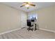Bedroom with a desk, office chair, and a large window with natural light at 7425 Enchanted Hills Ct, Las Vegas, NV 89129