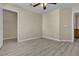 Large bedroom with light floors, neutral walls, standard closet and door to a bathroom at 7425 Enchanted Hills Ct, Las Vegas, NV 89129