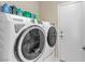 Modern laundry appliances with Smarter Laundry feature; top shelf has laundry detergent and cleaning supplies at 7425 Enchanted Hills Ct, Las Vegas, NV 89129
