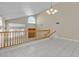 Open-concept living room featuring high ceilings, pendant lighting, and tile flooring at 7425 Enchanted Hills Ct, Las Vegas, NV 89129