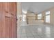 Bright and airy living room with tile flooring, a staircase, and plenty of natural light at 7425 Enchanted Hills Ct, Las Vegas, NV 89129