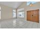 Bright, open living space with tile flooring, high vaulted ceilings, and ample natural light at 7425 Enchanted Hills Ct, Las Vegas, NV 89129