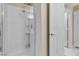 Walk-in shower stall with white tile and glass door, plus an adjustable shower head fixture at 7425 Enchanted Hills Ct, Las Vegas, NV 89129