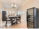 Formal dining room with chandelier and a wine refrigerator at 7690 Blue Whirlpool St, Las Vegas, NV 89131