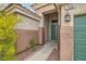 Inviting entryway featuring a covered porch with decorative lantern and address number at 7690 Blue Whirlpool St, Las Vegas, NV 89131