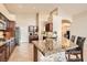 Open kitchen featuring granite countertops, stainless steel appliances, and a breakfast bar at 7690 Blue Whirlpool St, Las Vegas, NV 89131