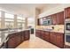 Spacious kitchen featuring granite countertops, stainless steel appliances, and a large island at 7690 Blue Whirlpool St, Las Vegas, NV 89131