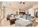 Bright and airy living room with tile floors, a sectional sofa, and an open layout at 7690 Blue Whirlpool St, Las Vegas, NV 89131