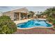 Beautiful pool and spa with outdoor kitchen in backyard, perfect for entertaining and relaxing at 7690 Blue Whirlpool St, Las Vegas, NV 89131