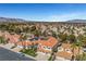 Gorgeous aerial view showcasing terra cotta-roofed homes and desert landscaping in a vibrant, well-maintained neighborhood at 8132 Bay Harbor Dr, Las Vegas, NV 89128